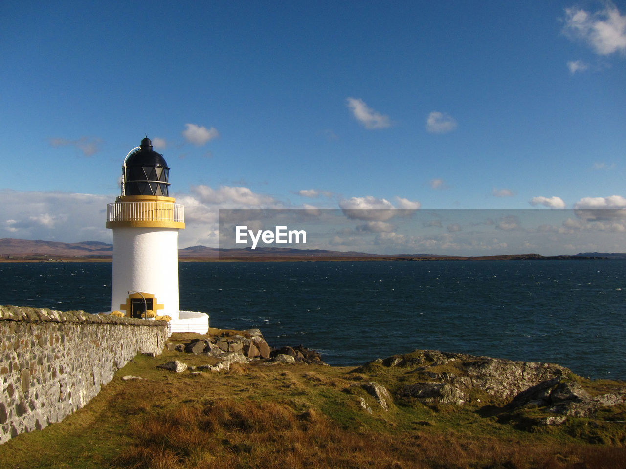 LIGHTHOUSE AGAINST SEA