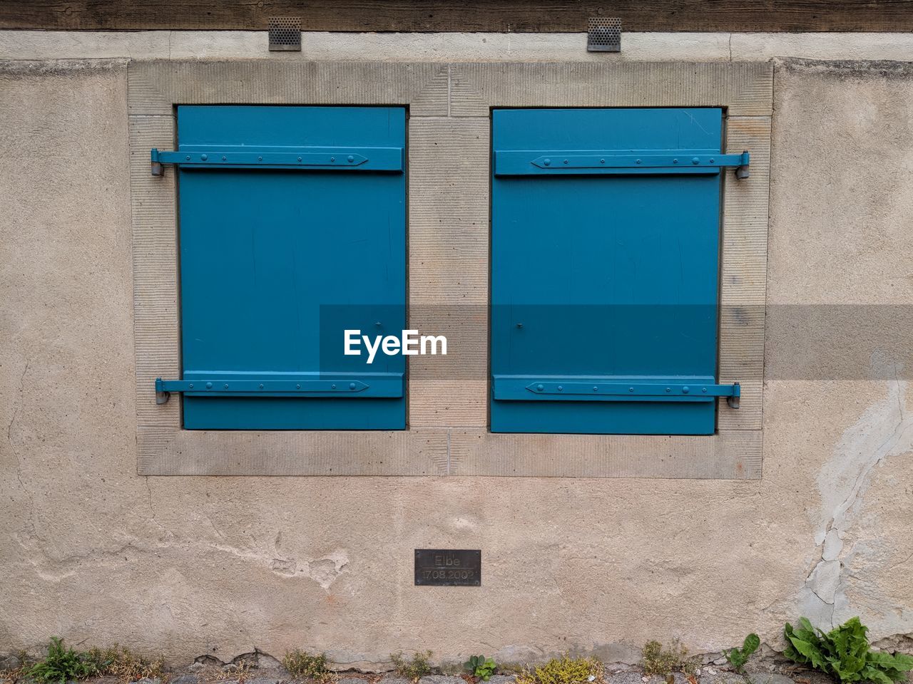 BLUE WINDOW OF BUILDING