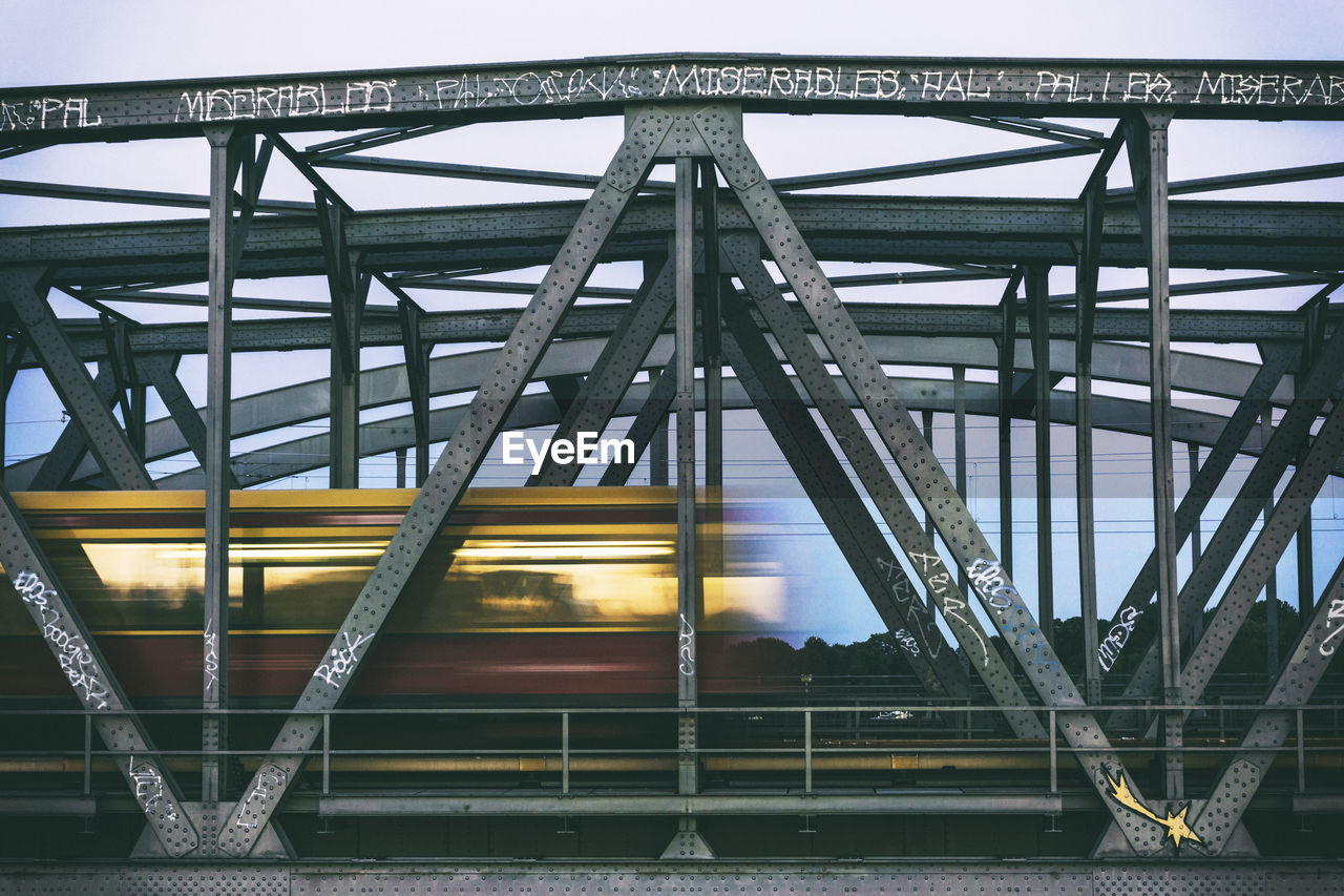 Blurred motion of train on railway bridge