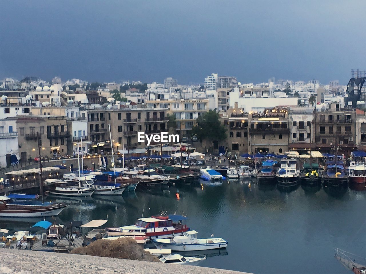 Boats moored at harbor