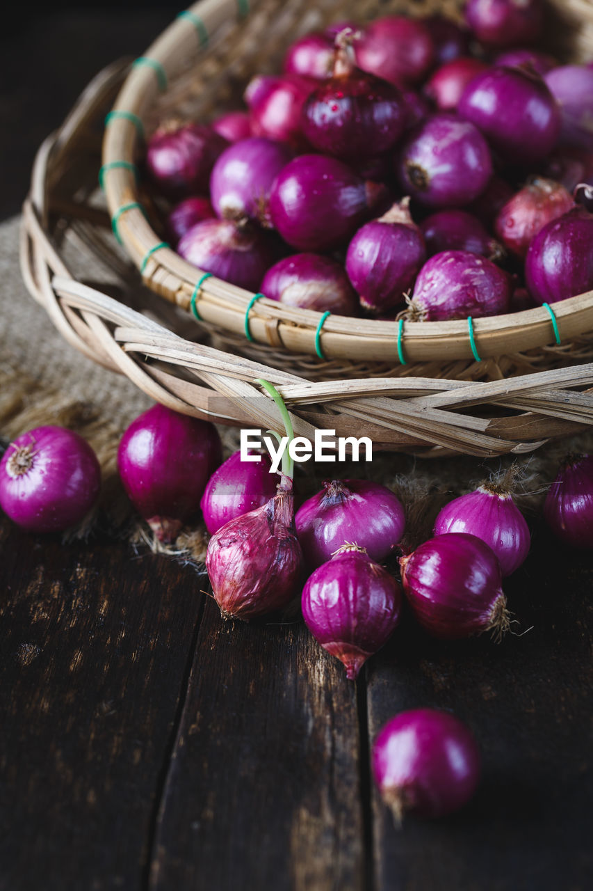 High angle view of shallots in basket on table