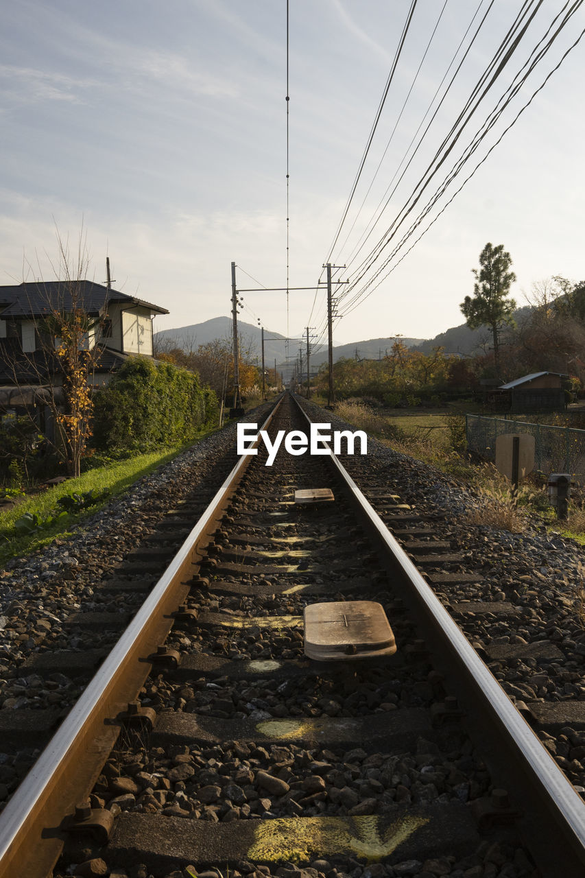 RAILROAD TRACK AGAINST SKY