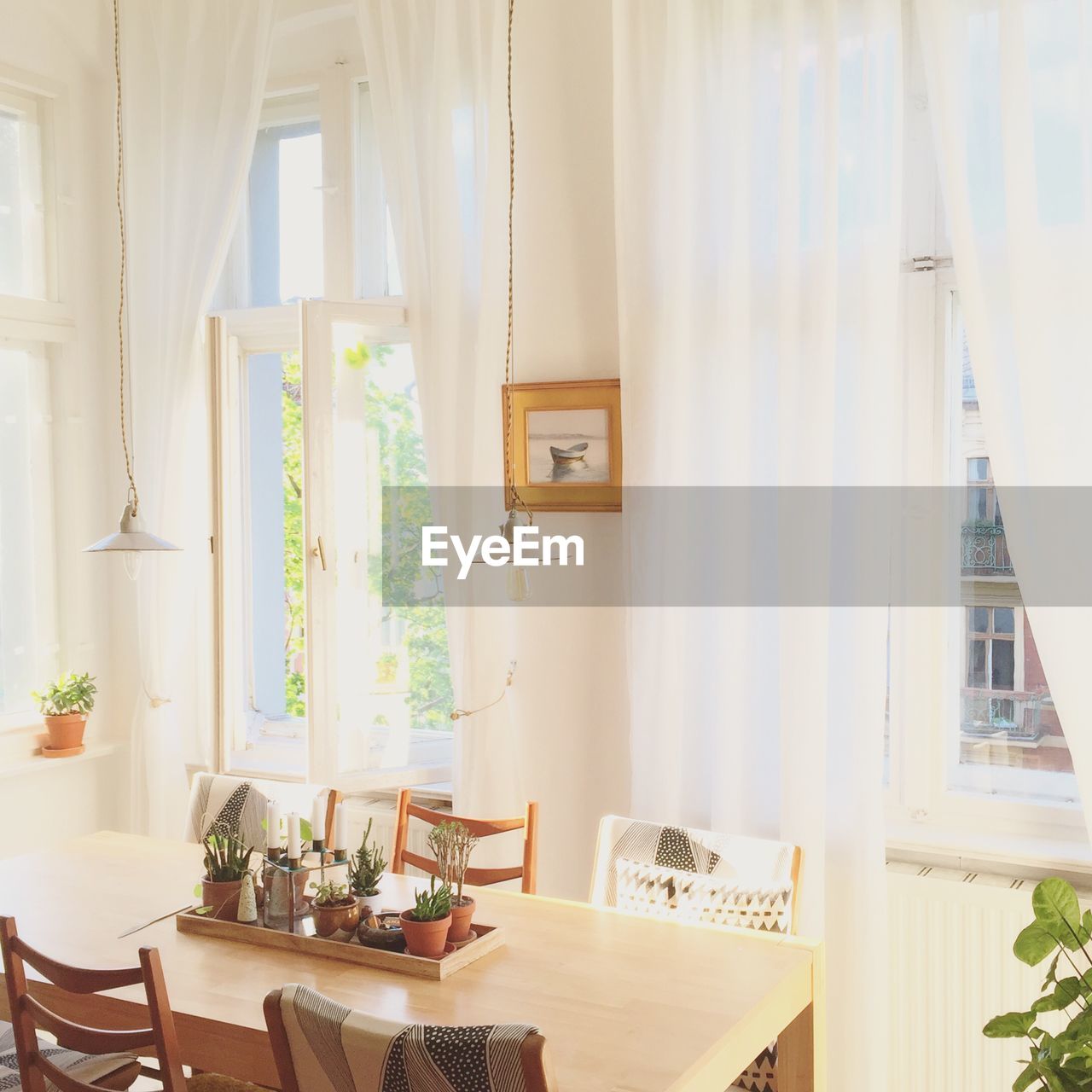 Table and chair by window at home