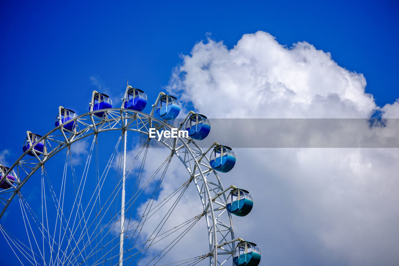 low angle view of ferris wheel against sky