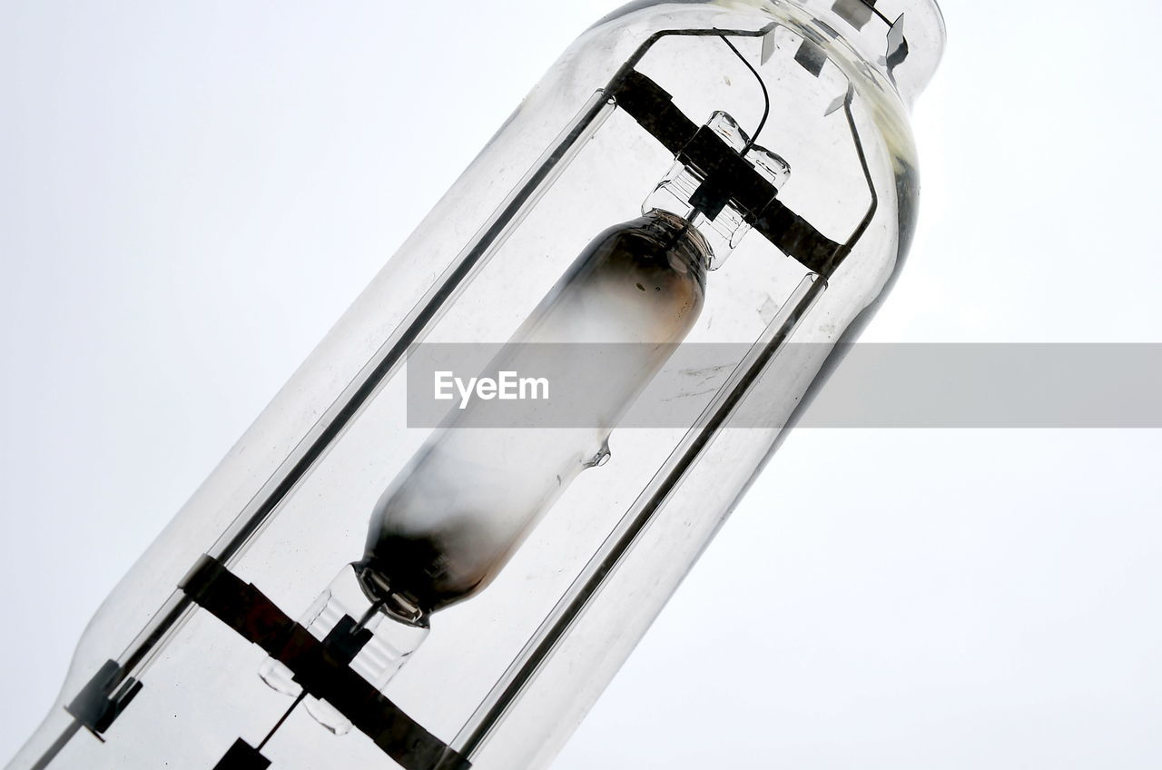 Close-up of lighting equipment on white background