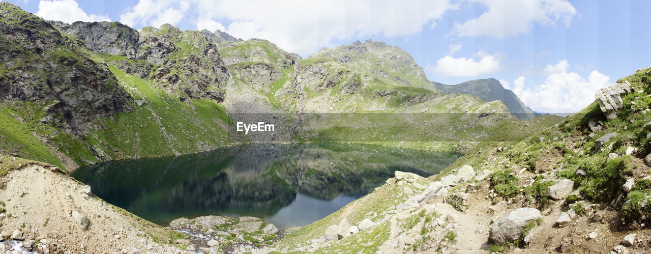 PANORAMIC VIEW OF ROCKS AGAINST SKY