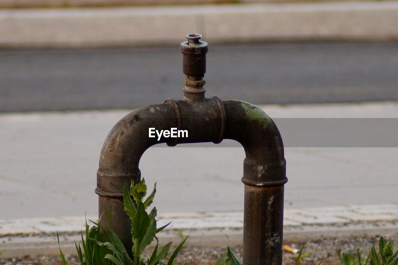 CLOSE-UP OF WATER PIPE FROM METAL