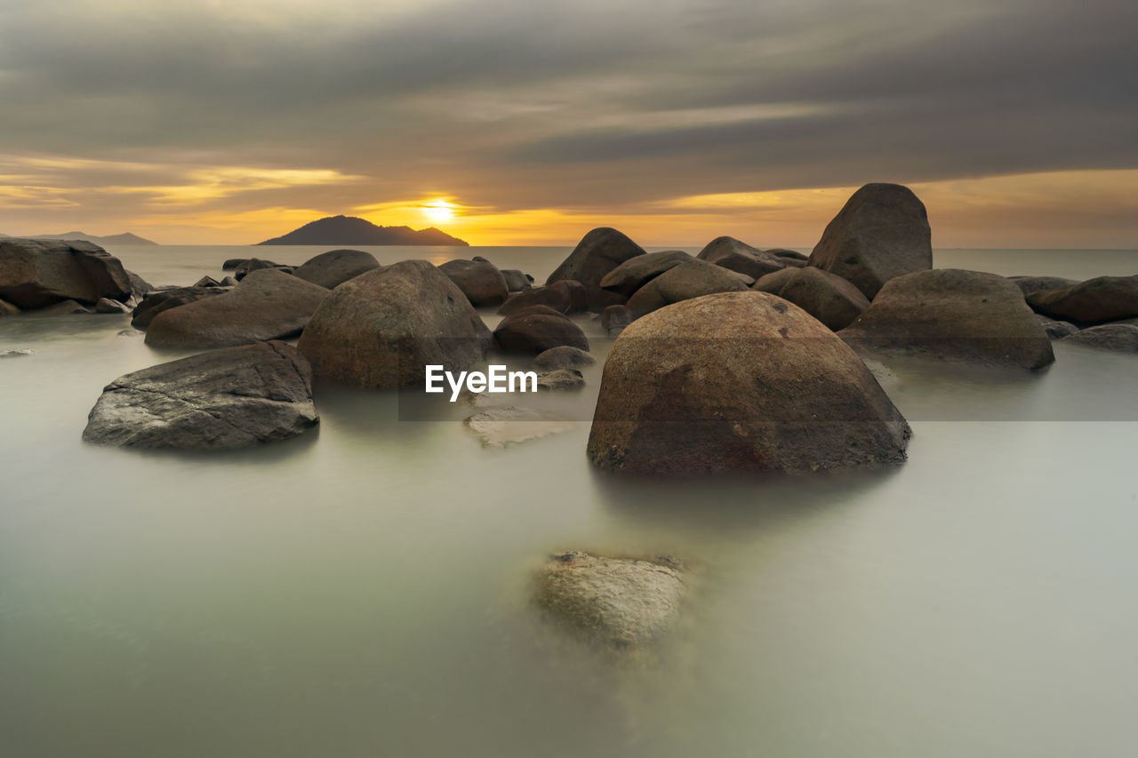 Scenic view of sea against sky during sunset