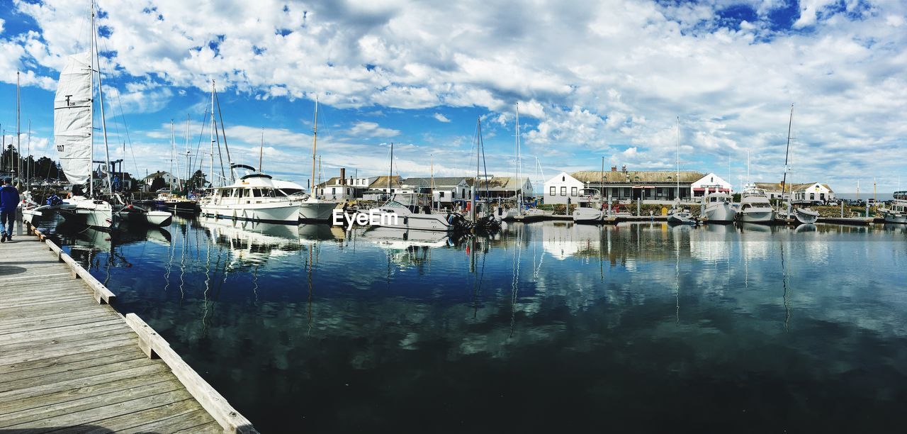 Boats moored at harbor