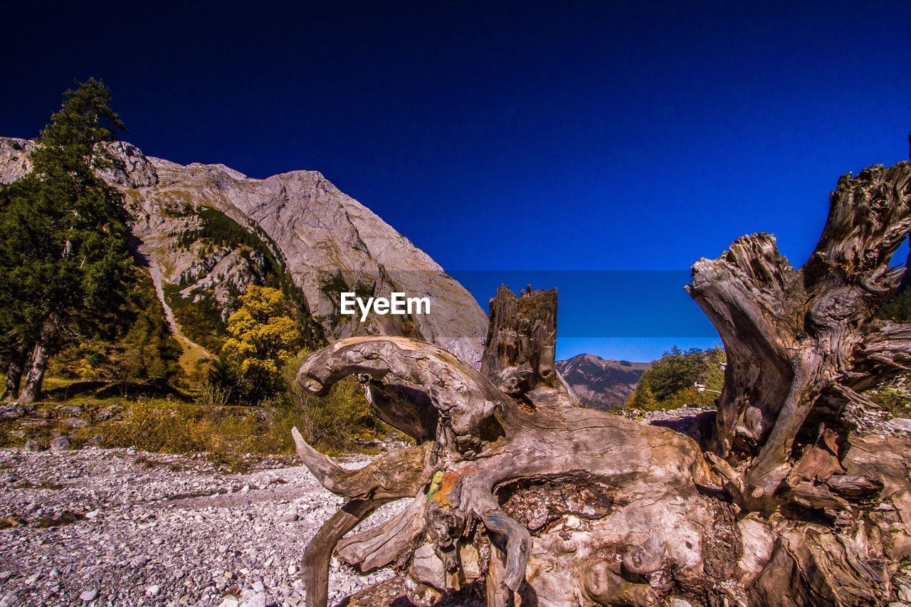 Scenic view of rock formation against clear blue sky