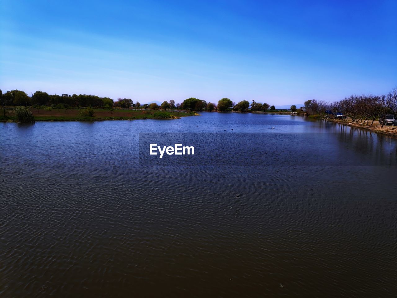 VIEW OF LAKE AGAINST SKY