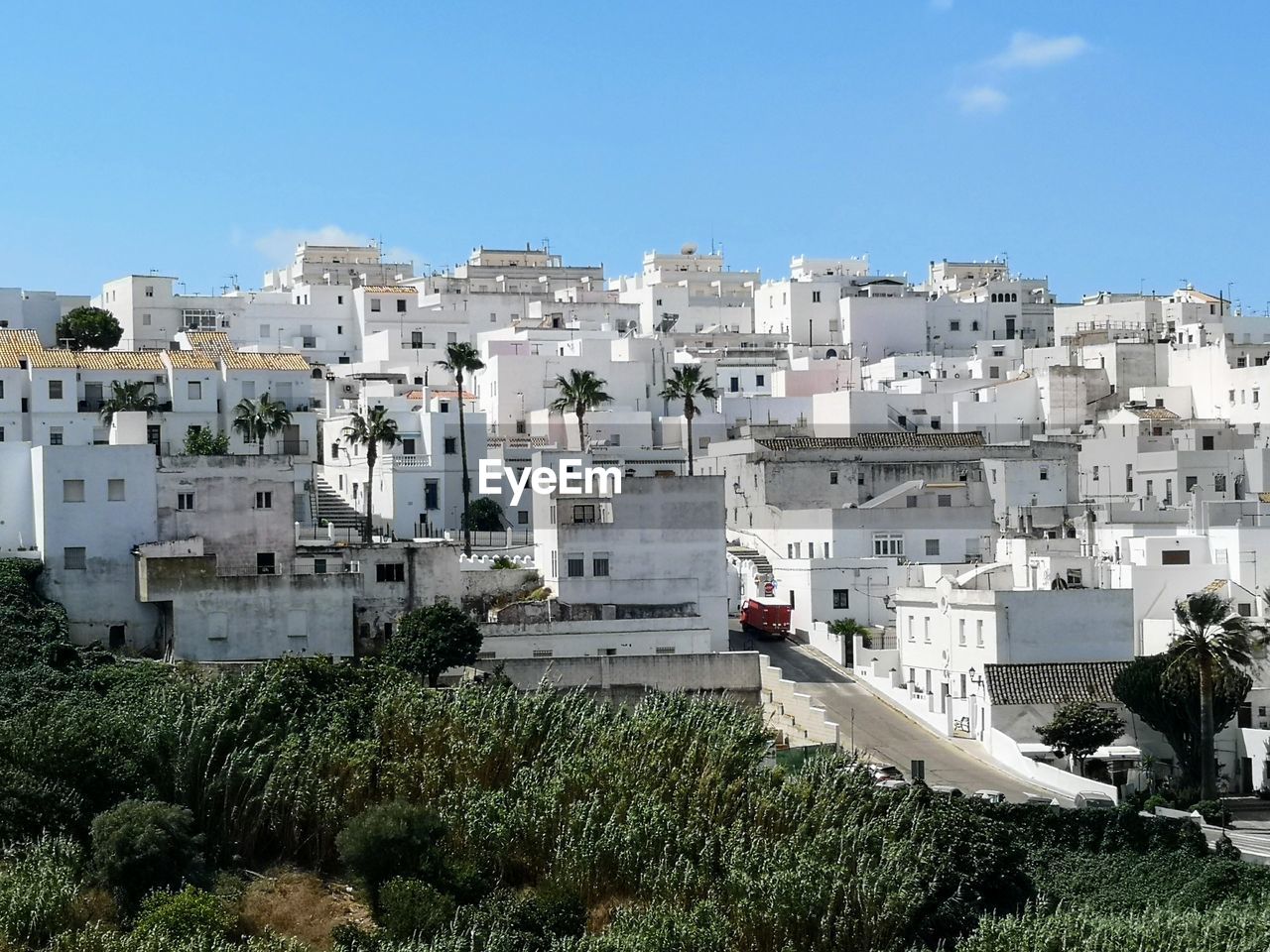 High angle view of townscape against blue sky