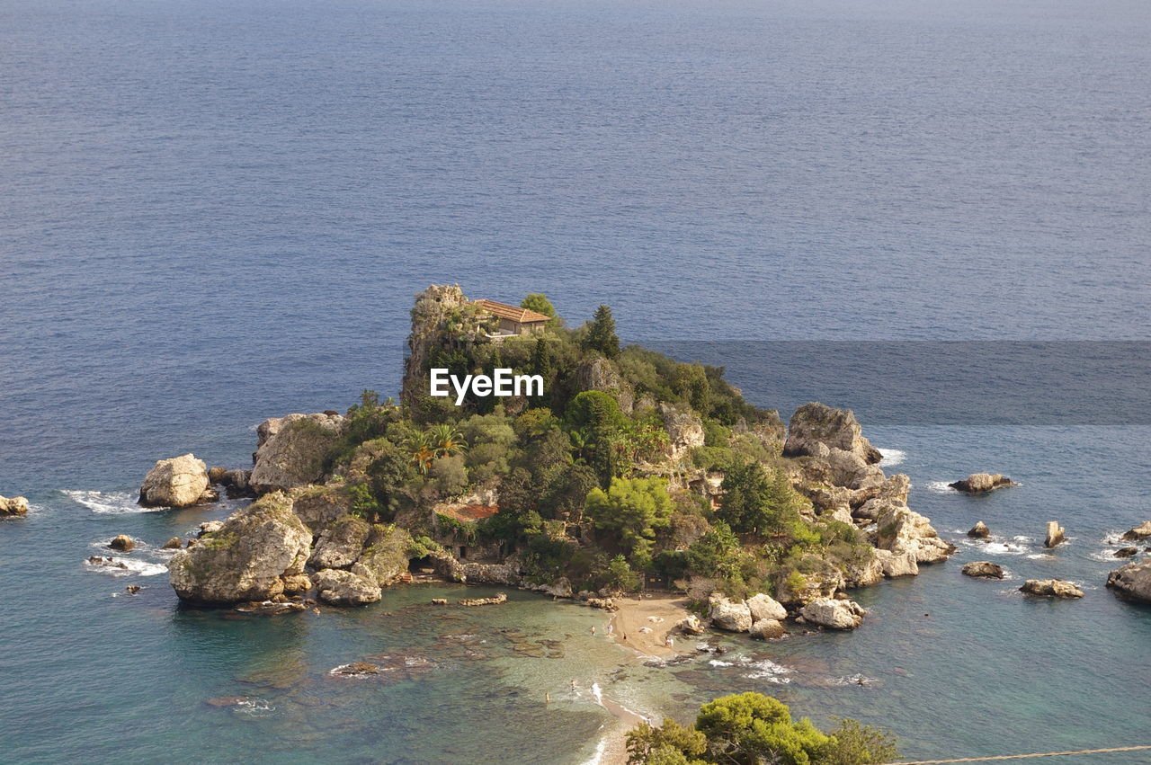 High angle view of rock by sea