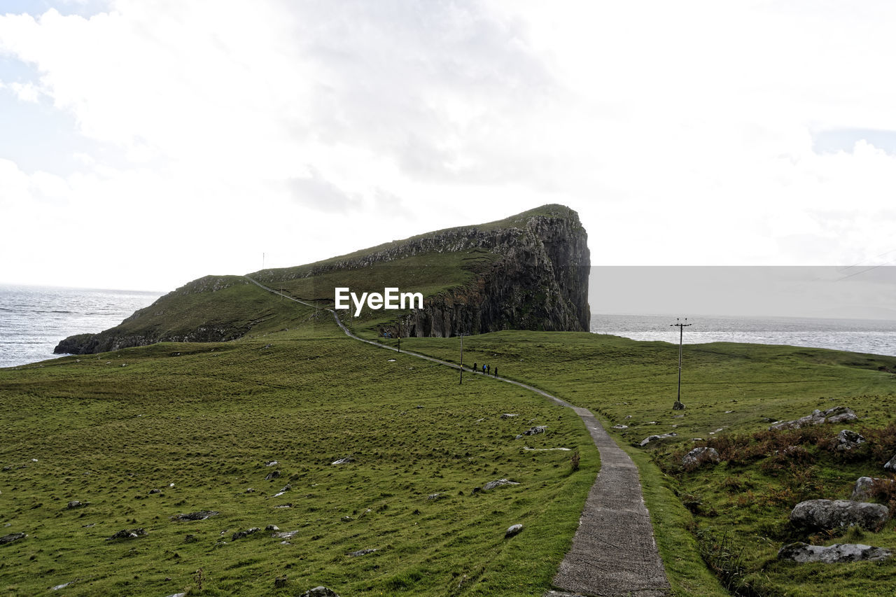 SCENIC VIEW OF SEA AND ROCKS AGAINST SKY