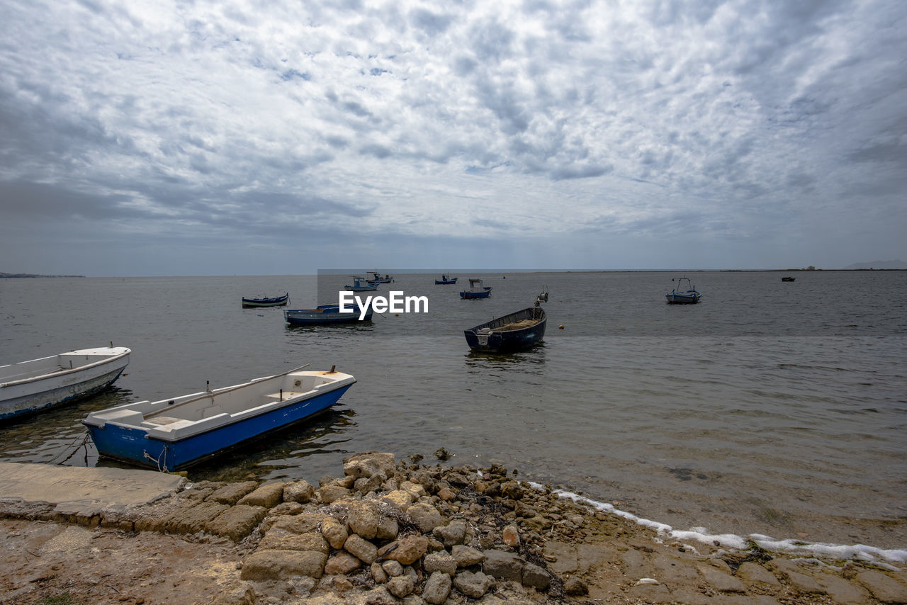 Small colorful fishing boats at the laguna dello stagnone marsala trapani sicily italy