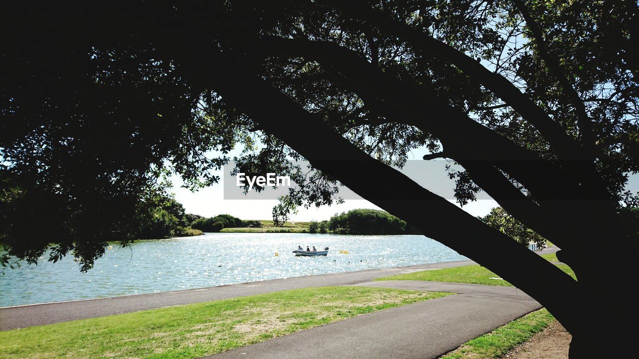 SCENIC VIEW OF LAKE AGAINST TREES