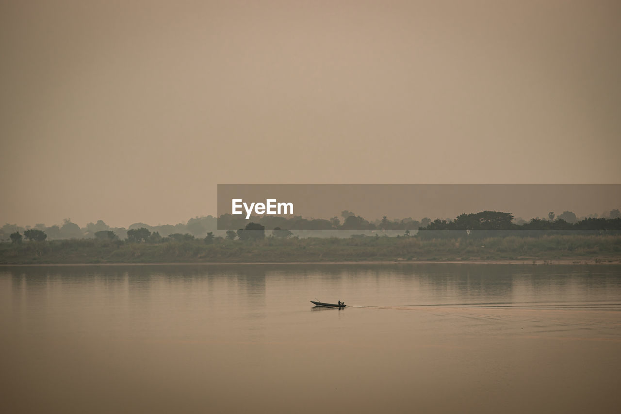 Scenic view of lake against clear sky