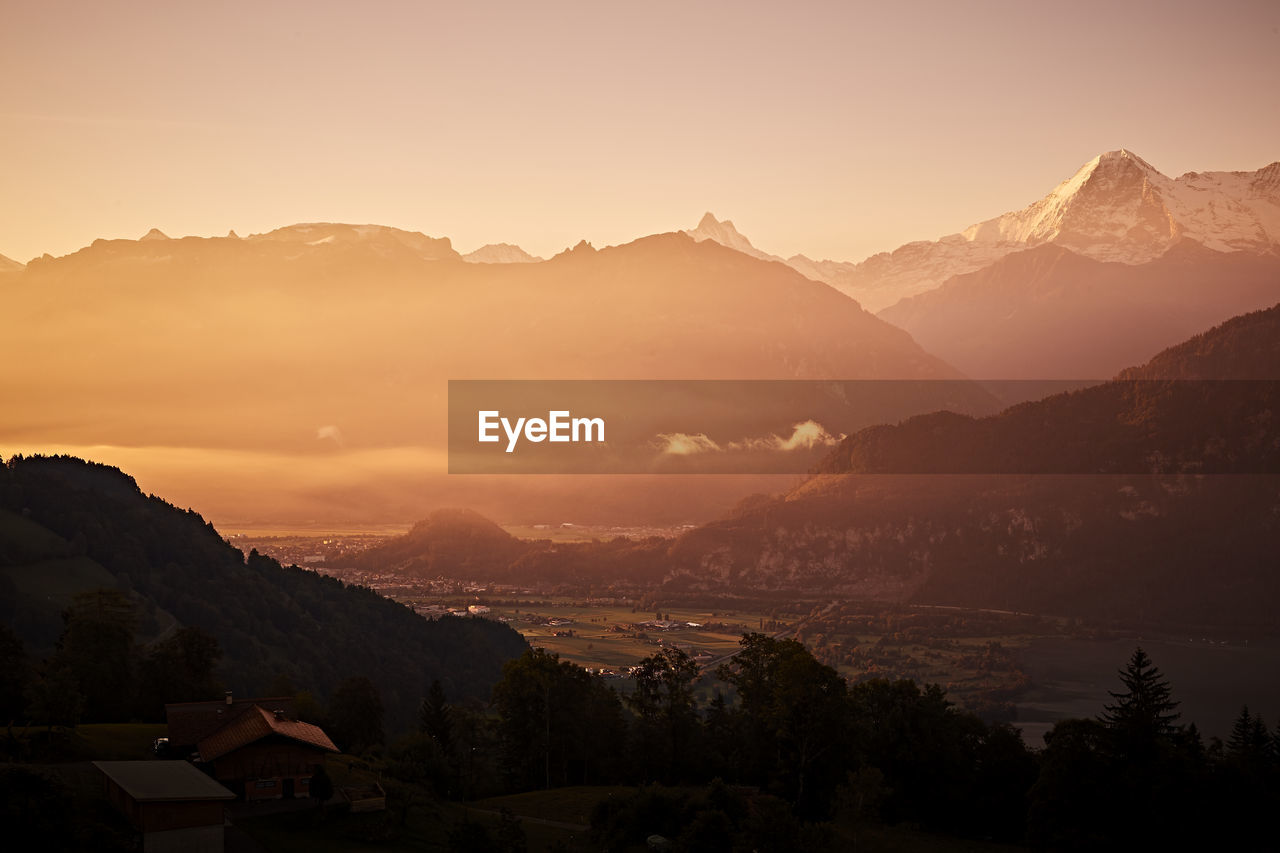 Scenic view of mountains against sky during sunset