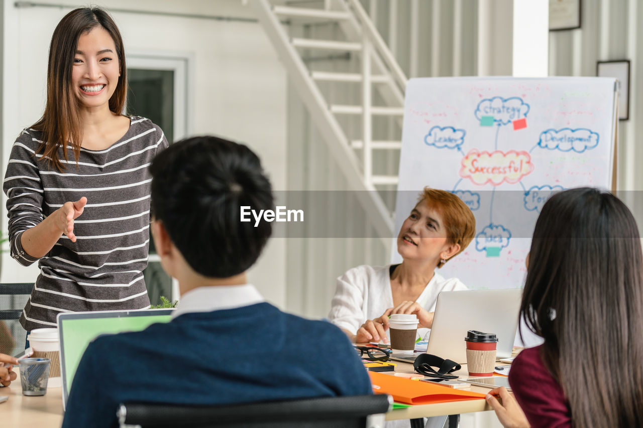 Group of asian and multiethnic business people with casual suit brainstorming