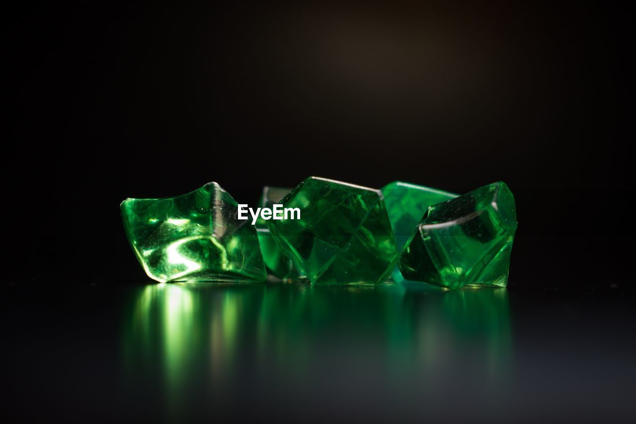 Close-up of green crystals on black background