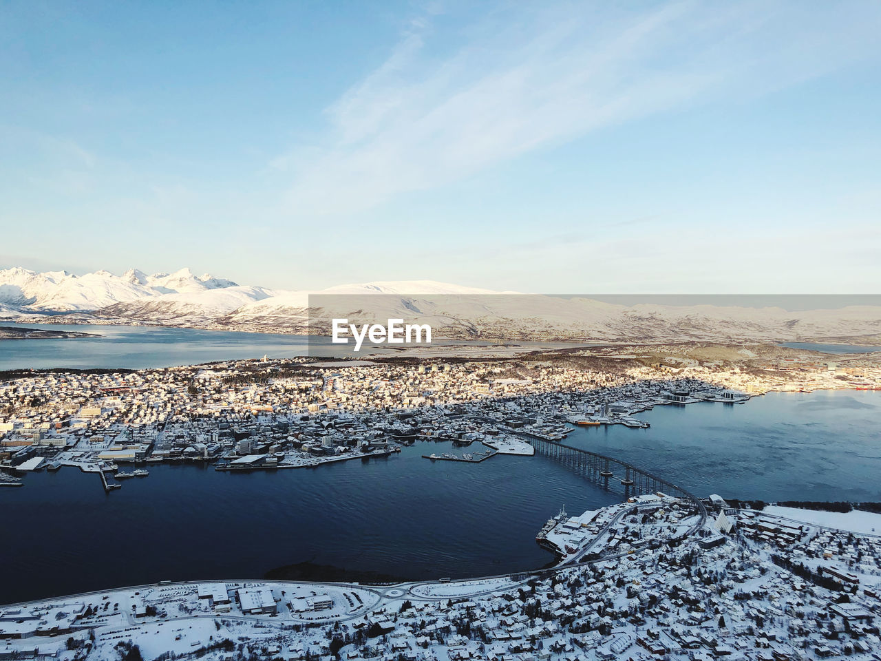 Scenic view of frozen lake against sky during winter