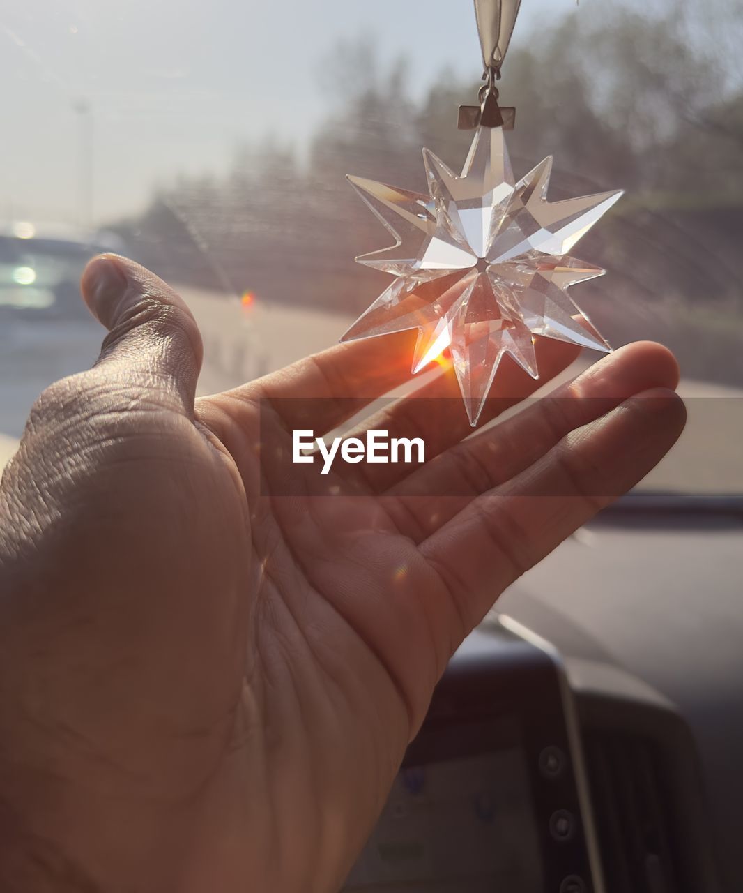 hand, one person, holding, nature, focus on foreground, light, finger, vehicle, close-up, illuminated, sky, personal perspective, adult, lighting, outdoors, transportation, mode of transportation, lifestyles, burning, celebration