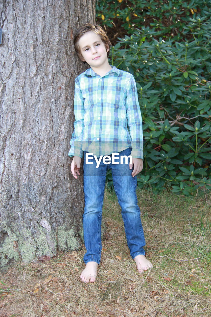 PORTRAIT OF BOY STANDING OUTDOORS