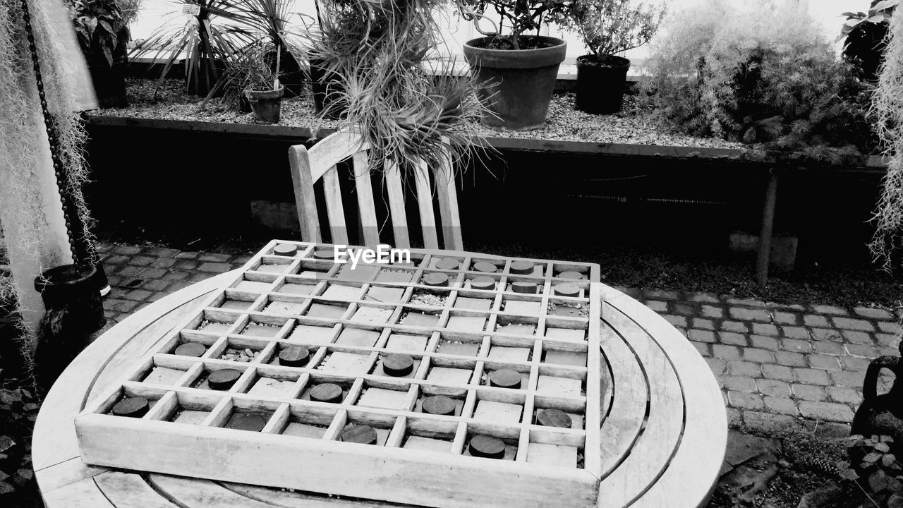 Close-up of board game on table in back yard