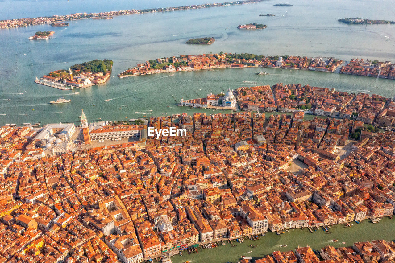 Amazing city view from above on building roofs and canals. aerial view of venice, san polo, italy