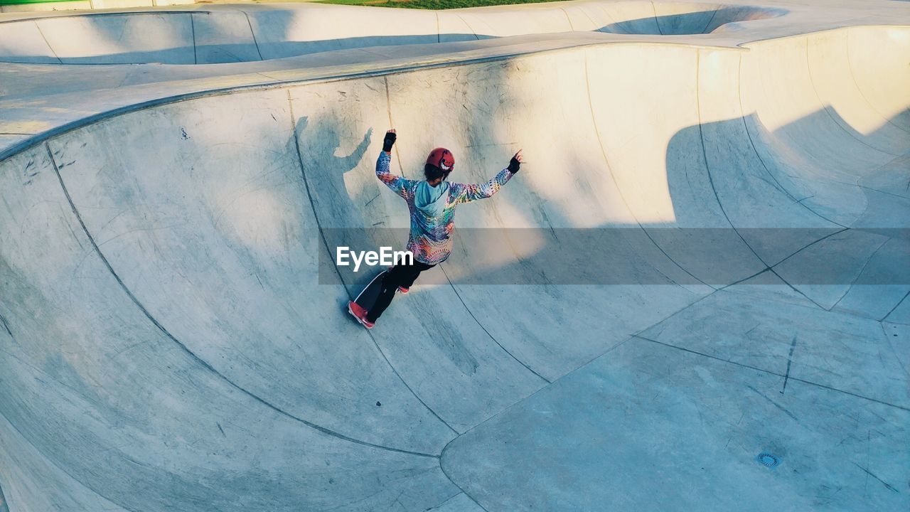 High angle view of woman skateboarding