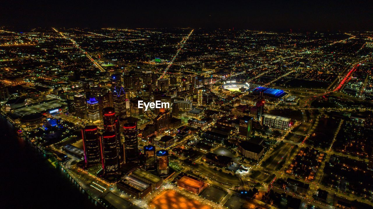 HIGH ANGLE VIEW OF ILLUMINATED CITY STREET