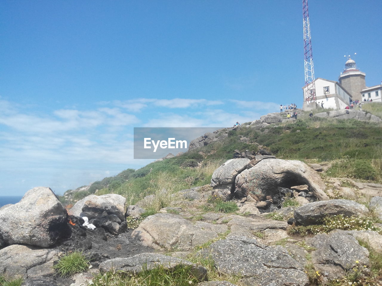 Low angle view of lighthouse at fisterra against sky