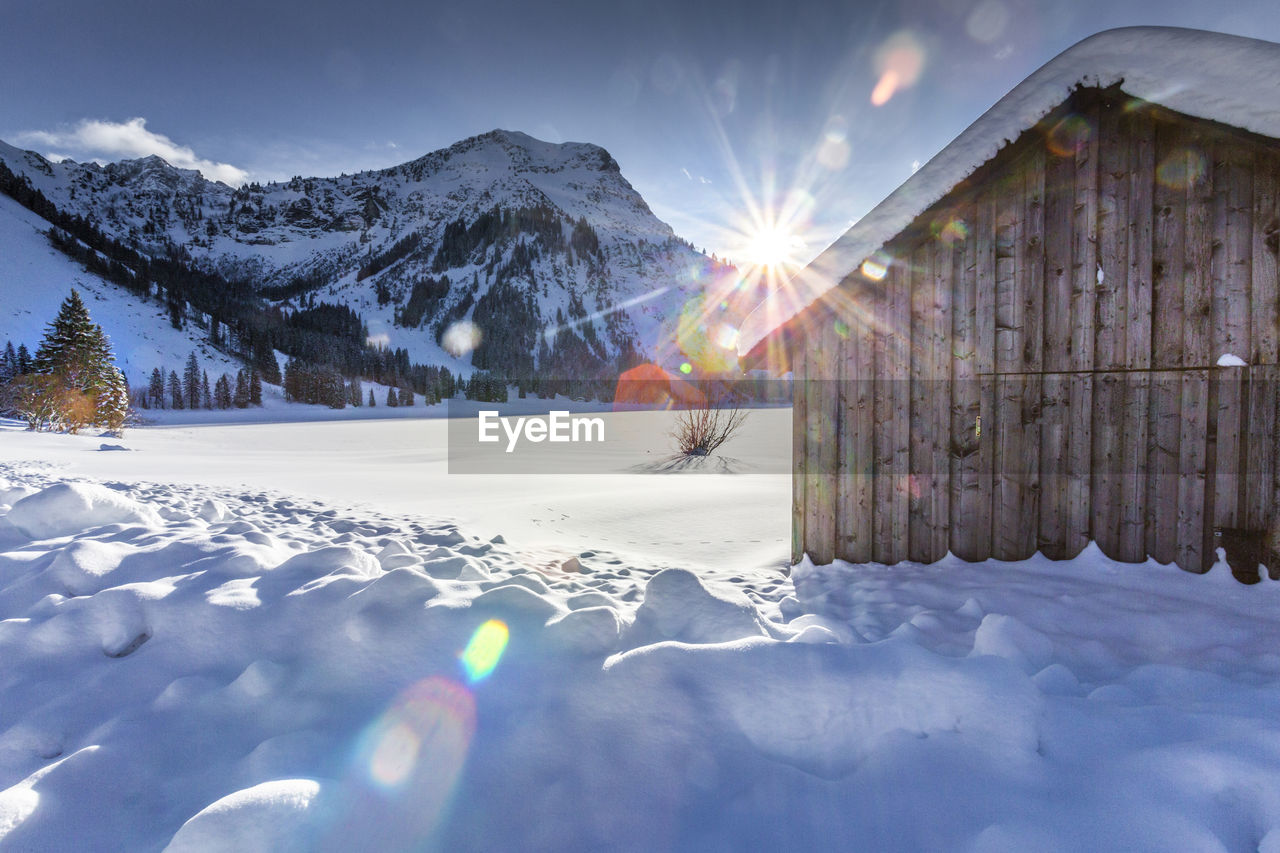 SCENIC VIEW OF SNOWCAPPED MOUNTAINS DURING WINTER