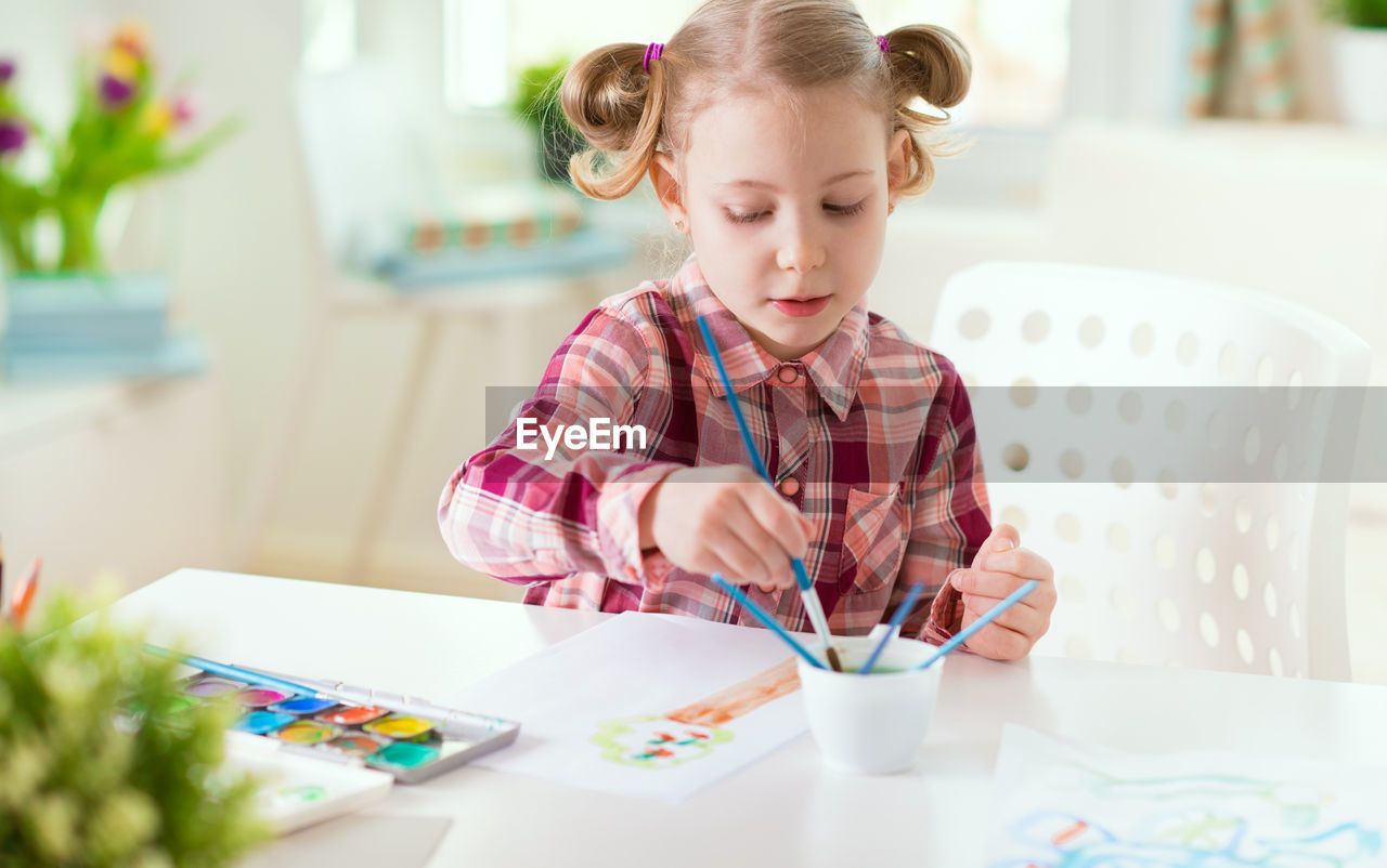 Girl painting at home