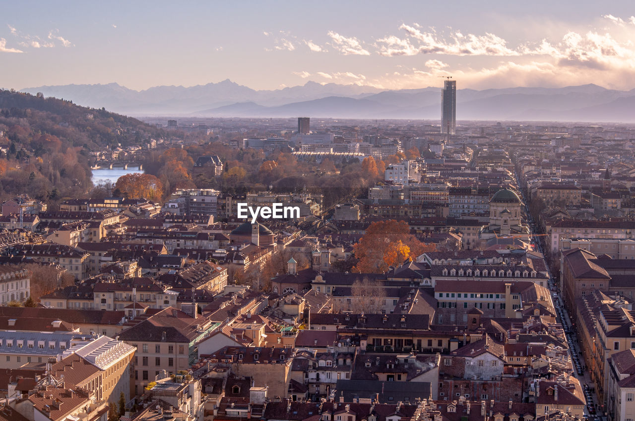 High angle view of city against sky during sunset