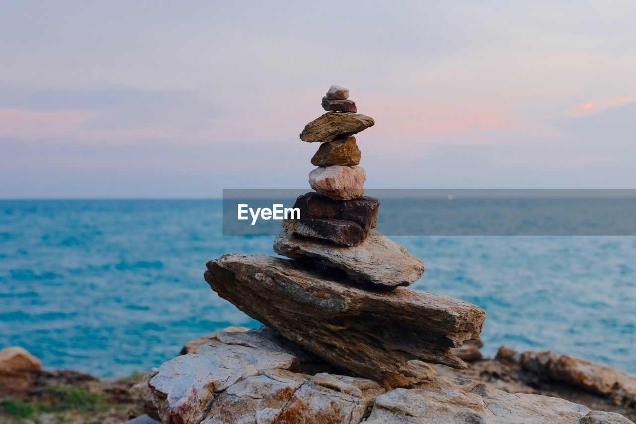 STACK OF PEBBLES ON SHORE