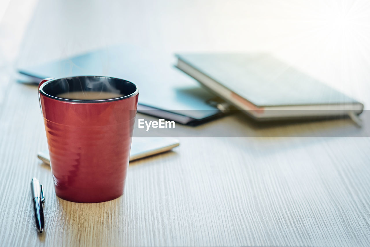 Close-up of coffee cup on table 