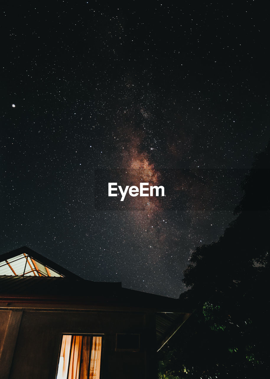 Low angle view of building against sky at night