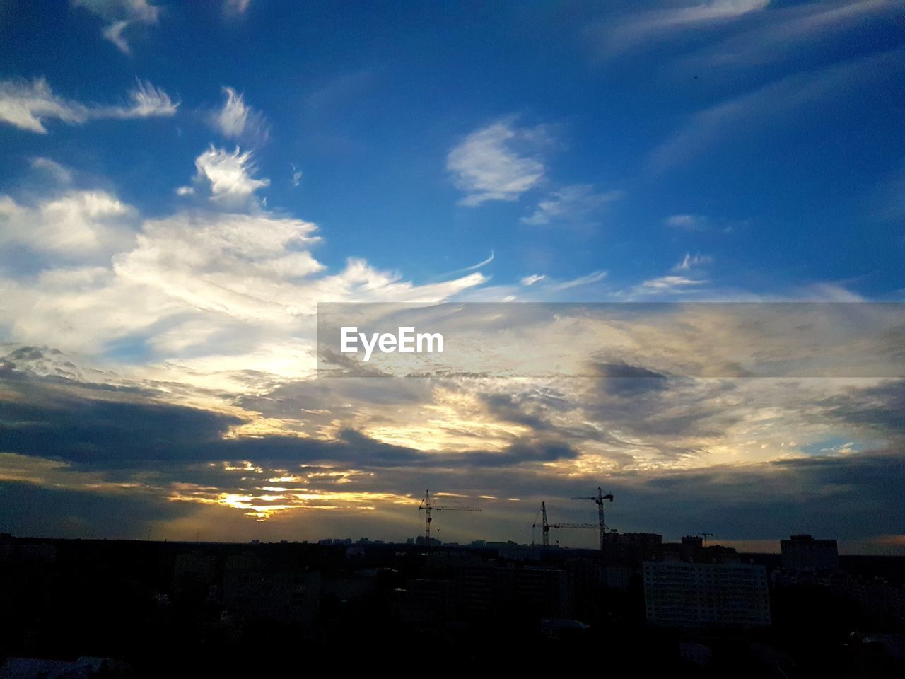 SILHOUETTE OF CITYSCAPE AGAINST SKY DURING SUNSET