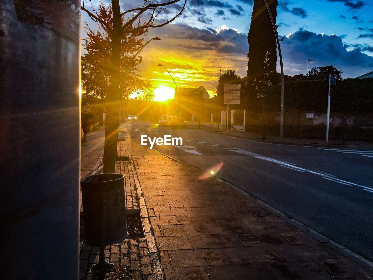 VIEW OF CITY STREET AT SUNSET