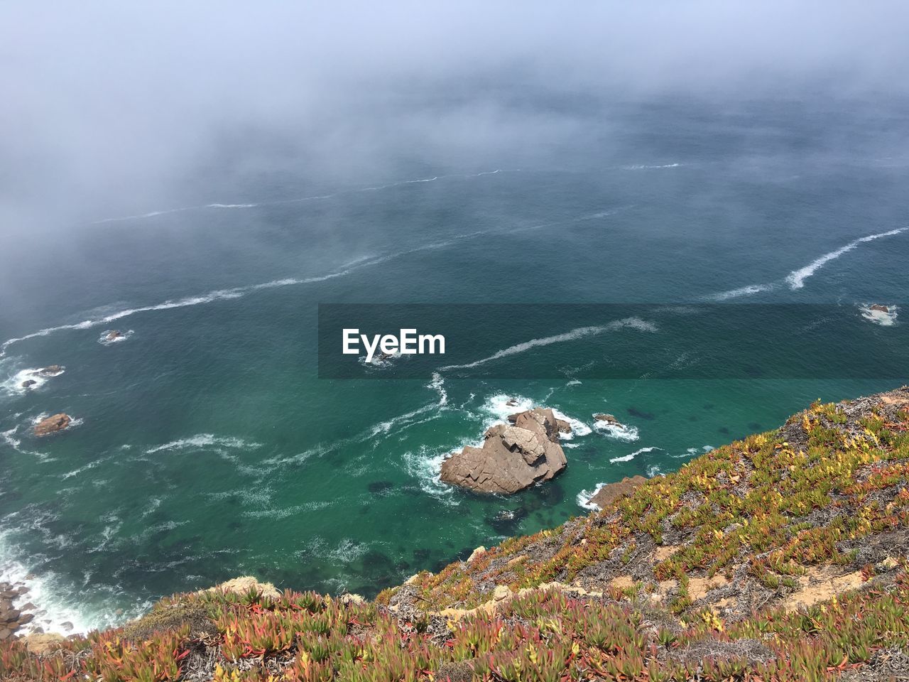 High angle view of rocks in sea