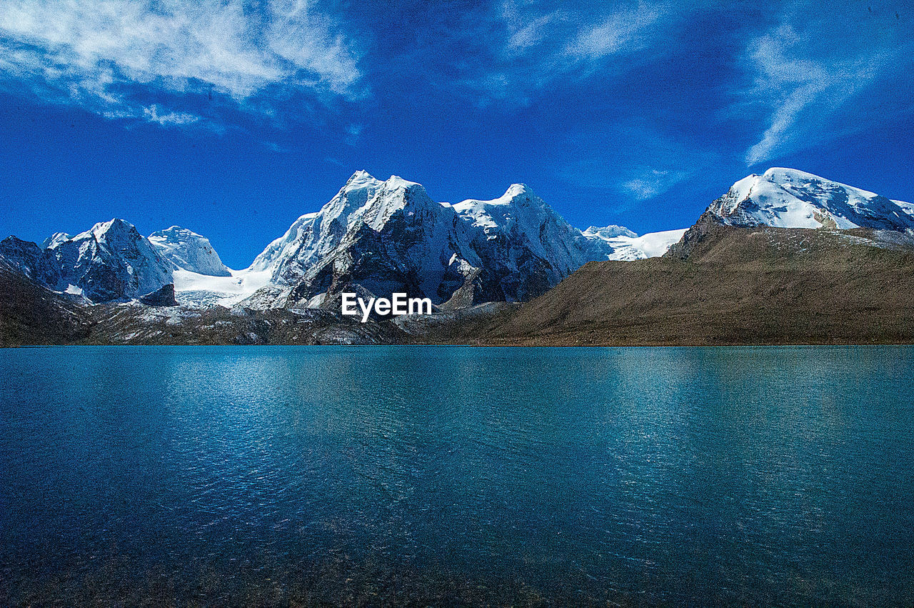 SCENIC VIEW OF SNOWCAPPED MOUNTAIN AGAINST SKY