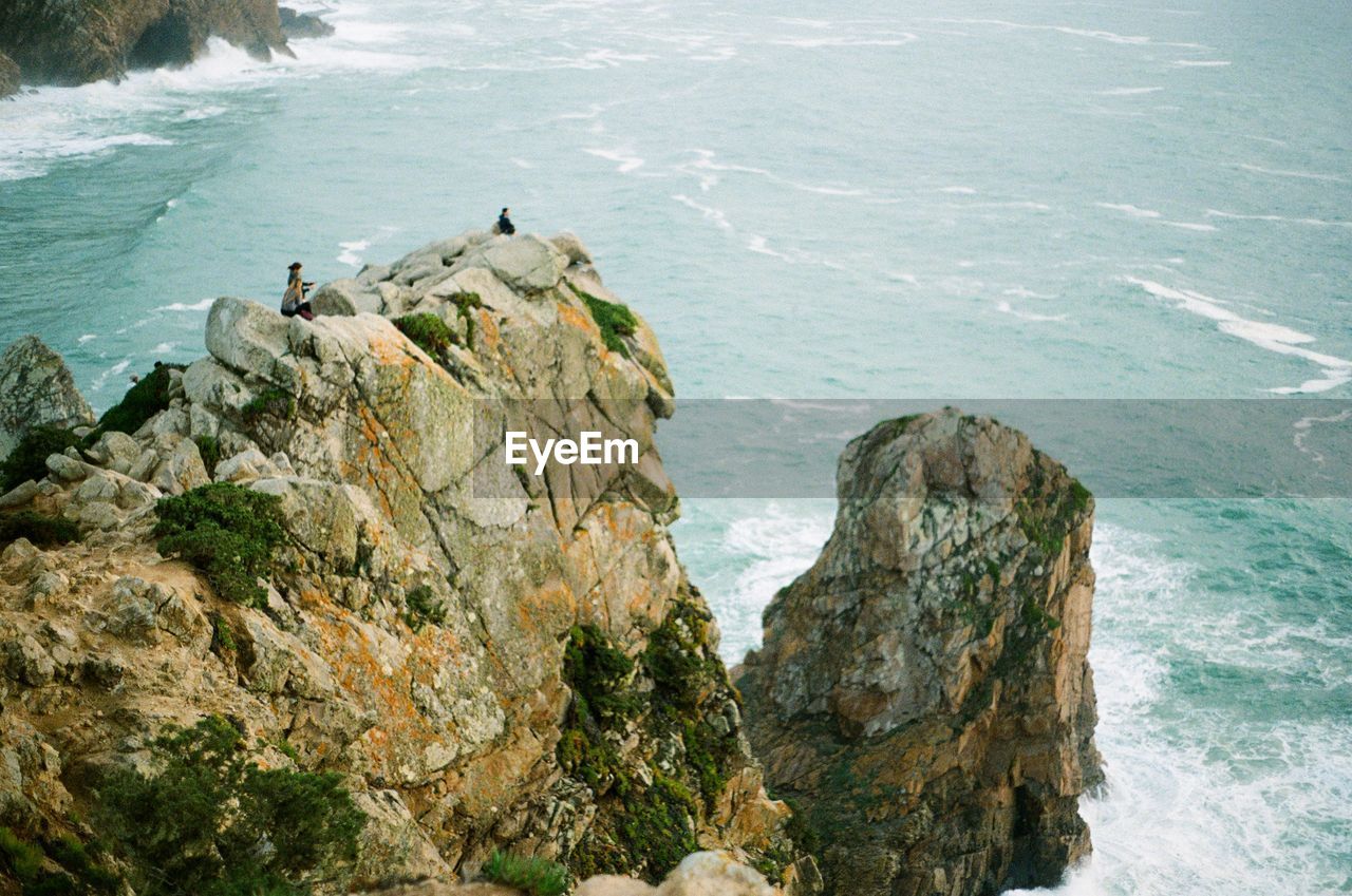 High angle view of rock formation by sea