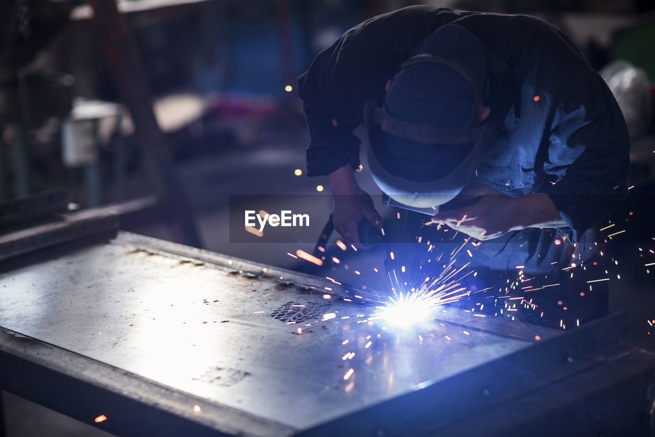 Welder at work in workshop