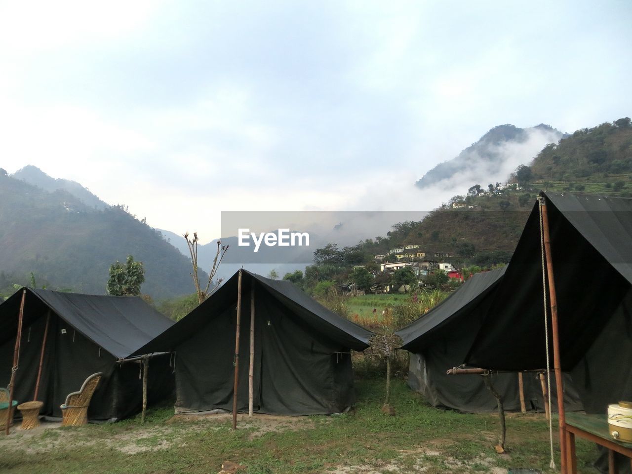 TENT IN MOUNTAINS