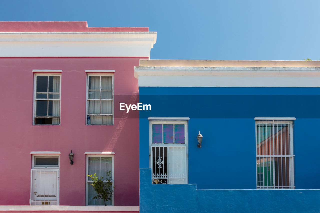 Colorful facades of old houses in pink and blue, bo kaap malay quarter, cape town, south africa