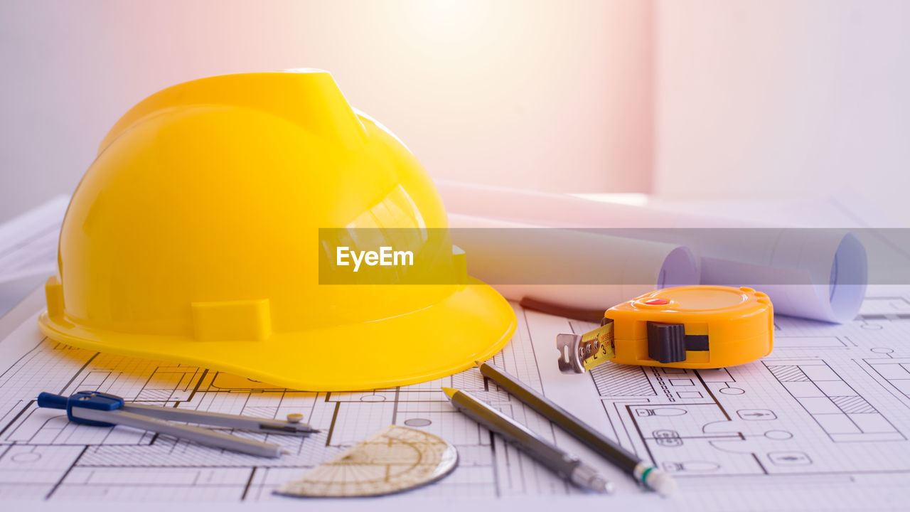 Close-up of yellow hat on table