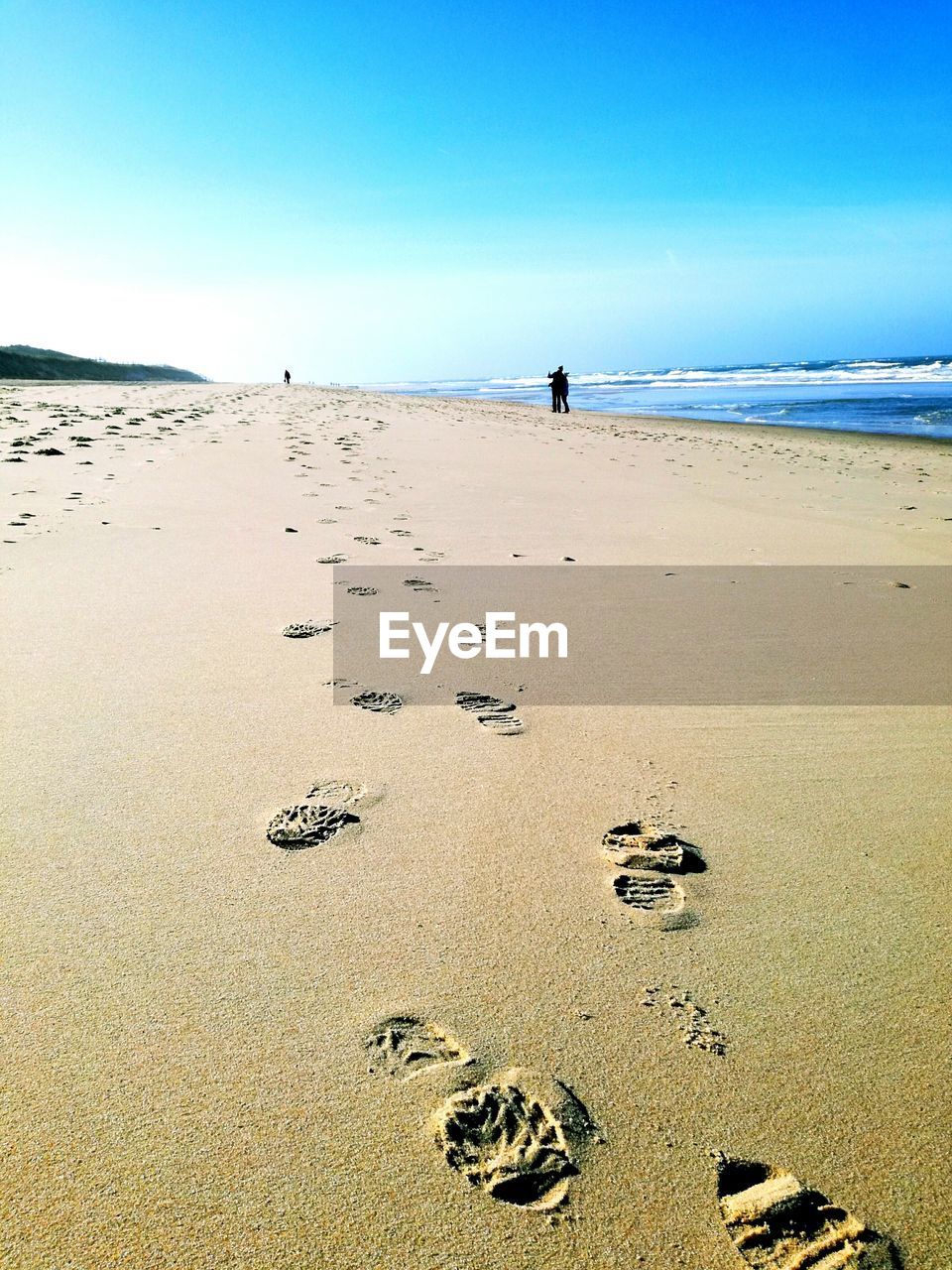 Scenic view of beach against clear sky