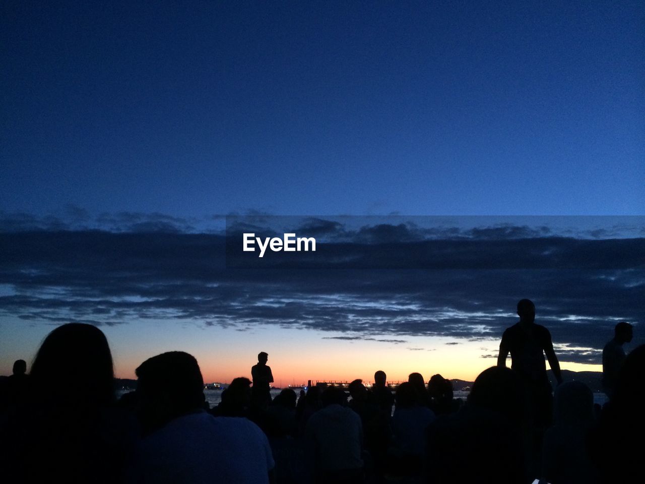 SILHOUETTE PEOPLE ON BEACH AT NIGHT