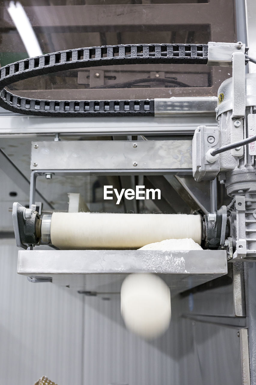 High angle view of flour in equipment at factory